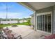 Covered patio with a fire pit and furniture overlooking a lush backyard at 720 Little Fawn Way, Myrtle Beach, SC 29579