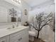 Well lit bathroom with decorative shower curtain and white vanity with a large mirror at 721 Dunlon Ct., Myrtle Beach, SC 29588