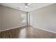 Bright and airy bedroom with a window, a ceiling fan, and a door, all set against neutral-colored walls at 721 Dunlon Ct., Myrtle Beach, SC 29588