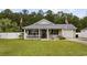 Charming single-story home with a well-manicured lawn, cozy front porch, and attached garage at 721 Dunlon Ct., Myrtle Beach, SC 29588