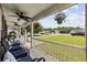 Inviting covered front porch with comfortable seating and hanging flower baskets, offering a relaxing outdoor space at 721 Dunlon Ct., Myrtle Beach, SC 29588