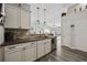 Modern kitchen with a breakfast bar, stainless steel appliances, and an open view to the living areas at 721 Dunlon Ct., Myrtle Beach, SC 29588