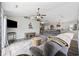 Inviting living room boasts a ceiling fan, a comfortable gray sofa, and stylish decor on display shelves at 721 Dunlon Ct., Myrtle Beach, SC 29588