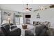 Cozy living room featuring comfortable seating, a ceiling fan, and sliding glass doors to the backyard at 721 Dunlon Ct., Myrtle Beach, SC 29588