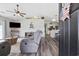 Open-concept living room with vaulted ceilings, flowing seamlessly into the kitchen and dining areas at 721 Dunlon Ct., Myrtle Beach, SC 29588