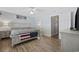 Comfortable main bedroom with light wood floors, ample natural light, and an attached en suite bathroom at 721 Dunlon Ct., Myrtle Beach, SC 29588