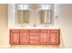 Bathroom featuring double sinks, framed mirrors and a stylish cabinet at 750 Shine Ave. # 750, Myrtle Beach, SC 29577