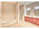 Spacious bathroom featuring double sinks, a soaking tub, and a separate shower at 750 Shine Ave. # 750, Myrtle Beach, SC 29577