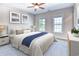 Comfortable bedroom featuring a plush bed, neutral tones, and natural light from large windows at 750 Shine Ave. # 750, Myrtle Beach, SC 29577