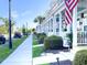 Street view showcasing a row of charming homes with welcoming front porches and manicured lawns at 750 Shine Ave. # 750, Myrtle Beach, SC 29577
