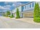 Modern townhome exteriors with attached garages and manicured green spaces at 750 Shine Ave. # 750, Myrtle Beach, SC 29577