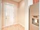 Hallway area with a refrigerator and a white door at 750 Shine Ave. # 750, Myrtle Beach, SC 29577