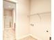 Functional laundry room with shelving, washer/dryer hookups, and convenient access to the bathroom at 750 Shine Ave. # 750, Myrtle Beach, SC 29577