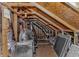This attic has exposed wood beams, insulation and ventilation system to control the temperature and improve air quality at 751 Painted Bunting Dr. # E, Murrells Inlet, SC 29576