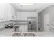 Bright kitchen with stainless steel appliances, white cabinets and gray counter, and a double sink at 751 Painted Bunting Dr. # E, Murrells Inlet, SC 29576