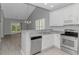Kitchen with stainless appliances, white cabinets, modern countertops, and an open design at 751 Painted Bunting Dr. # E, Murrells Inlet, SC 29576