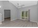 Open living room featuring sliding glass doors, wood-style flooring, and gray walls at 751 Painted Bunting Dr. # E, Murrells Inlet, SC 29576