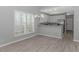 Open floor plan featuring a kitchen with stainless steel appliances and a dining area with a chandelier at 751 Painted Bunting Dr. # E, Murrells Inlet, SC 29576