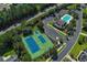 Aerial shot of the community featuring a tennis court, swimming pool, clubhouse, and ample parking at 81 Cascade Dr., Murrells Inlet, SC 29576
