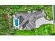 Aerial view of the property showing the pool, lush landscaping, and expansive roofline at 81 Cascade Dr., Murrells Inlet, SC 29576