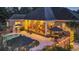 Inviting backyard pool with patio, elegant lighting and screened-in porch is ideal for entertaining and relaxation at 81 Cascade Dr., Murrells Inlet, SC 29576