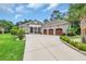 Charming single story home with a three car garage and spacious driveway surrounded by lush landscaping at 81 Cascade Dr., Murrells Inlet, SC 29576