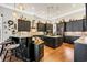 Gourmet kitchen featuring dark cabinets, stone backsplash, hardwood floors and a center island at 81 Cascade Dr., Murrells Inlet, SC 29576