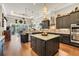 Stylish kitchen with dark cabinetry, stainless steel appliances, and a center island, ideal for gatherings at 81 Cascade Dr., Murrells Inlet, SC 29576