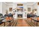 Cozy living room with a fireplace, hardwood floors, and tasteful decor, creating a warm ambiance at 81 Cascade Dr., Murrells Inlet, SC 29576