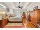 Primary bedroom suite boasting hardwood floors, tray ceiling, and lots of natural light at 81 Cascade Dr., Murrells Inlet, SC 29576