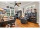 Home office with hardwood floors, ample natural light, ceiling fan, and built-in bookcase and cabinets at 81 Cascade Dr., Murrells Inlet, SC 29576