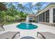 Inviting backyard pool featuring a water fountain, lounge chairs, and ample patio space for outdoor relaxation at 81 Cascade Dr., Murrells Inlet, SC 29576