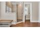 Walk-in shower showcasing neutral tile work, river rock floor, and glass enclosure in a well-lit bathroom at 81 Cascade Dr., Murrells Inlet, SC 29576