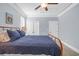 Comfortable bedroom featuring blue quilted bedding and ample natural light from large windows at 840 Jeter Ln., Myrtle Beach, SC 29588