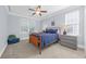 Well-lit bedroom with blue bedding, side tables, and windows providing natural light and comfort at 840 Jeter Ln., Myrtle Beach, SC 29588