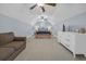 Spacious bedroom featuring vaulted ceilings, ceiling fans, and a comfortable seating area at 840 Jeter Ln., Myrtle Beach, SC 29588