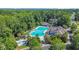 Resort-style community pool with ample seating and lush landscaping, perfect for relaxation and recreation at 840 Jeter Ln., Myrtle Beach, SC 29588