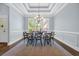 Dining room with coffered ceilings, natural light, and seating for six guests at 840 Jeter Ln., Myrtle Beach, SC 29588