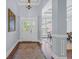 Elegant foyer with hardwood floors, soft blue walls, and decorative doorway at 840 Jeter Ln., Myrtle Beach, SC 29588
