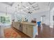 Open kitchen with a large island, granite countertops, and a decorative coffered ceiling at 840 Jeter Ln., Myrtle Beach, SC 29588