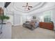 Spacious main bedroom with tray ceiling, multiple windows, and carpet floors at 840 Jeter Ln., Myrtle Beach, SC 29588