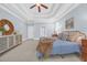Spacious main bedroom with tray ceiling, multiple windows, and carpet floors at 840 Jeter Ln., Myrtle Beach, SC 29588