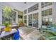 Inviting covered patio features tile floors, comfortable seating, and a large sliding glass door to the interior at 840 Jeter Ln., Myrtle Beach, SC 29588