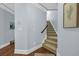Carpeted stairs with wooden handrail and white trim at 840 Jeter Ln., Myrtle Beach, SC 29588