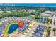 Expansive aerial view of a coastal community with picturesque ponds, lush greenery, and the ocean skyline in the distance at 8469 Cape Dutch Loop, Myrtle Beach, SC 29572