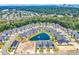 Stunning aerial view of a residential community surrounding a serene pond, showcasing neighborhood layout and landscaping at 8469 Cape Dutch Loop, Myrtle Beach, SC 29572