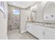 Bathroom with double vanity with marble counters and walk-in shower at 8469 Cape Dutch Loop, Myrtle Beach, SC 29572