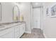Bright bathroom with double vanity featuring marble countertops and modern fixtures at 8469 Cape Dutch Loop, Myrtle Beach, SC 29572