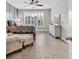 Relaxing bedroom with wainscoting, wood-look flooring, and a large window at 8469 Cape Dutch Loop, Myrtle Beach, SC 29572