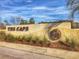 The Cape's entrance sign features the neighborhood's logo on a textured, stucco wall with manicured landscaping at 8469 Cape Dutch Loop, Myrtle Beach, SC 29572